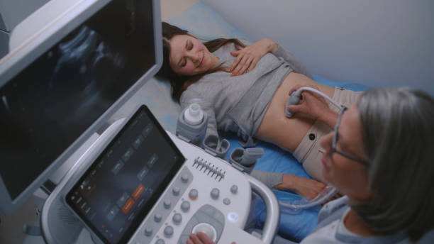 istock Female doctor conducts ultrasound diagnostics using sonography machine 1998472820