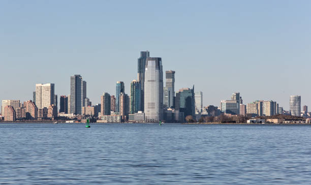 istock downtown jersey city nj view (tall buildings on the waterfront with hudson river in the foreground) new jersey 1998529089