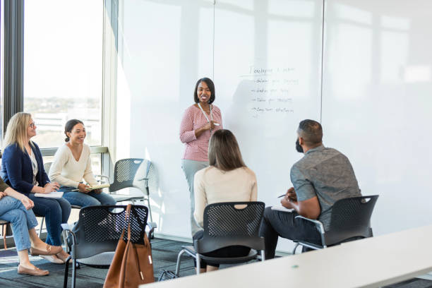 istock Multiracial team meets in conference room to develop strategy 1998567534