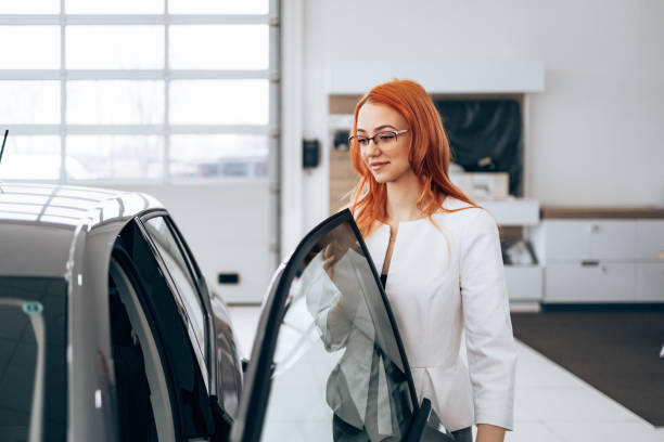 istock Sales manager at car showroom 1998581907