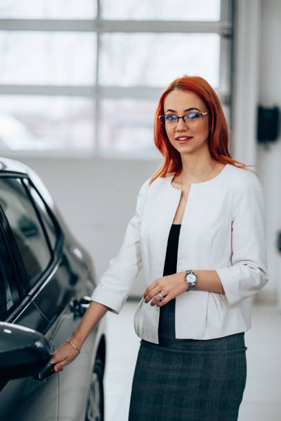 istock Sales manager at car showroom 1998586276