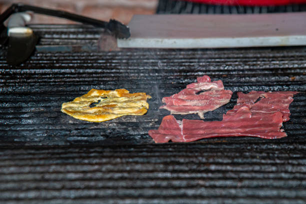 istock grilled steak for roasting over fire with charcoal and wood 1998626809