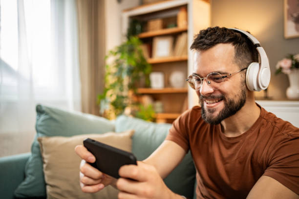 istock A man playing video games on his smartphone 1998653507