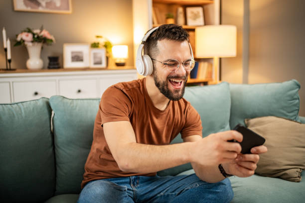 istock A man playing video games on his smartphone 1998654041