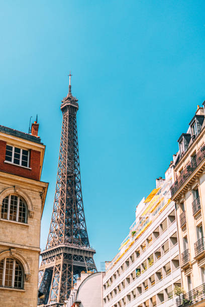 istock Low Angle View of the Eiffel Tower, Framed by Flats in the Summer 1998654049