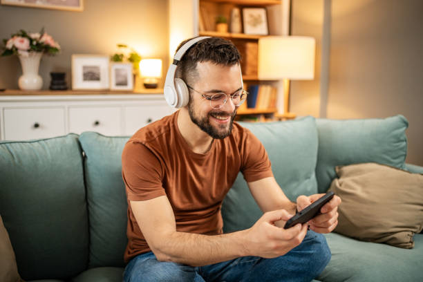 istock A man playing video games on his smartphone 1998654556