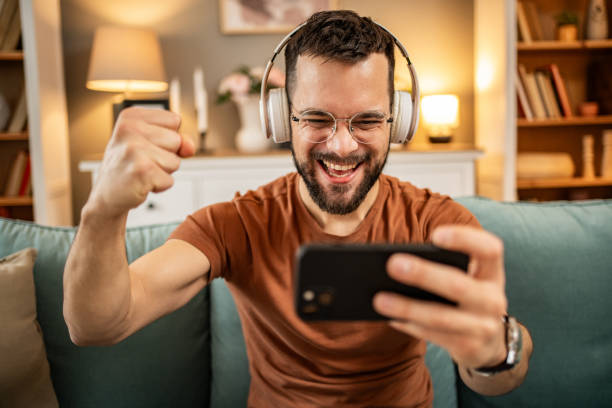 istock A man playing video games on his smartphone 1998654558