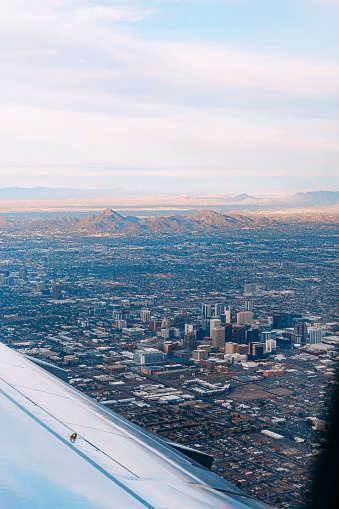 Airplane Passenger’s View of Downtown Phoenix, Arizona at Sunset, with Squaw Peak in the Background