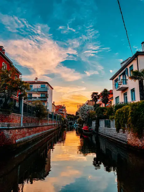 Vibrant-Colored Sunset over a Canal in Lido di Venezia, outside Venice, Italy