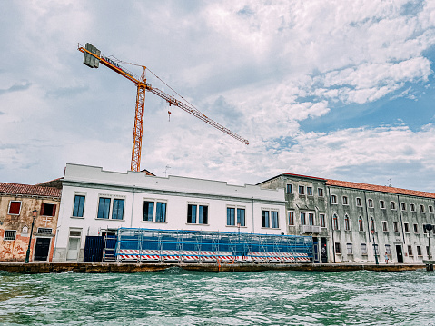 Construction Zone and Tall Crane Machinery on Giudecca, south of Venice, Italy