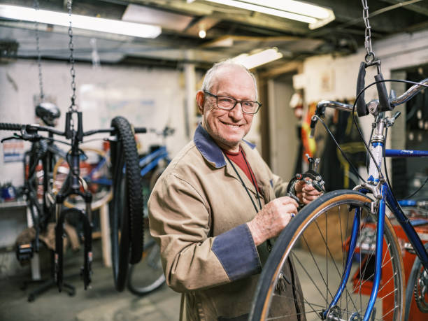istock Senior man working in his bicycle shop 1998702608