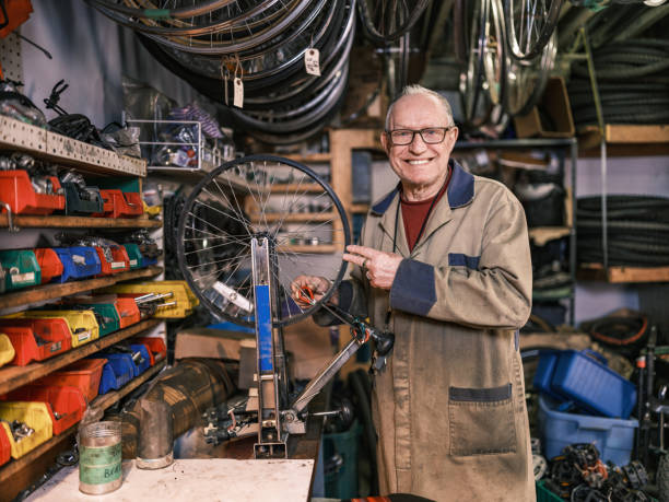 istock Senior man working in his bicycle shop 1998703654