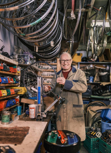 istock Senior man working in his bicycle shop 1998703655