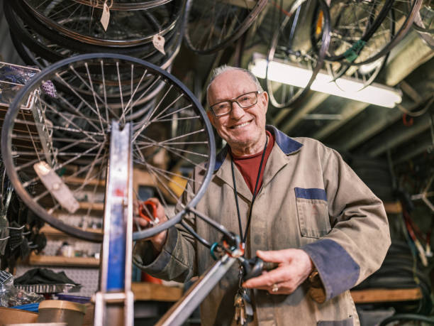 istock Senior man working in his bicycle shop 1998703923