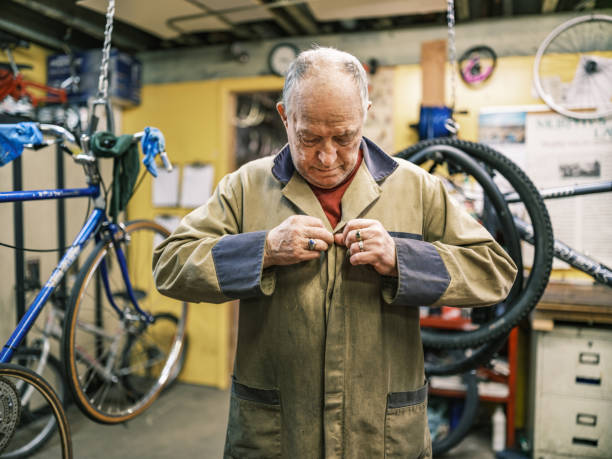 istock Senior man working in his bicycle shop 1998725498