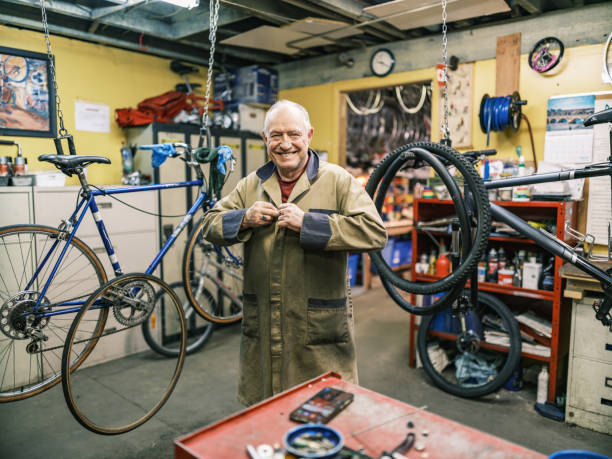 istock Senior man working in his bicycle shop 1998725499