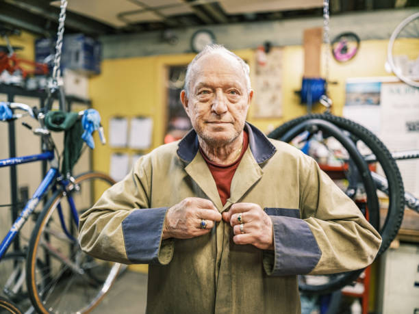 istock Senior man working in his bicycle shop 1998725504
