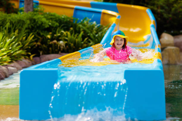 istock Kids on water slide in aqua park. Summer vacation 1998738449