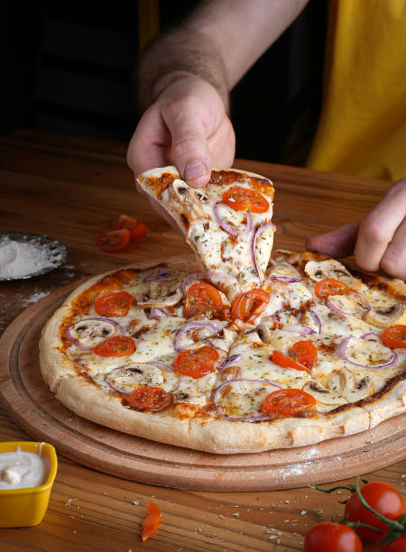 istock pizza containing tomato and mushroom ,onion, cheese 1998755191