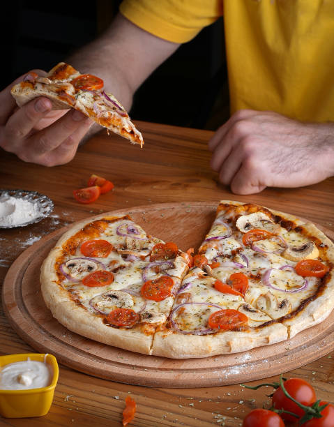 istock pizza containing tomato and mushroom ,onion, cheese 1998755194
