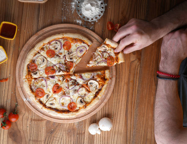 istock pizza containing tomato and mushroom ,onion, cheese 1998755197
