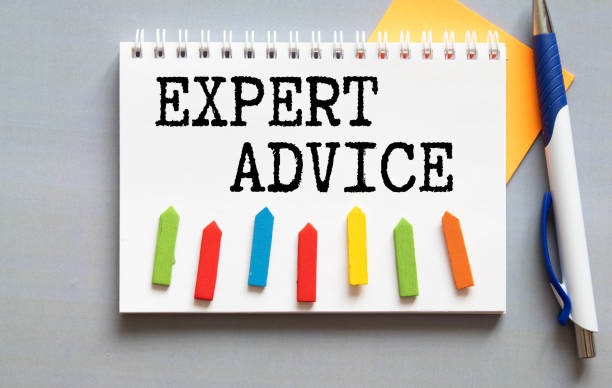 istock paper with text EXPERT ADVICE and pen, glasses and magnifier 1998800240
