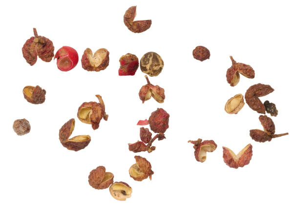 istock Mixture of red and black peppercorns on isolated background 1998821527