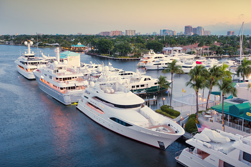 Luxury yachts are docked in Fort Lauderdale, Florida, USA at dawn.