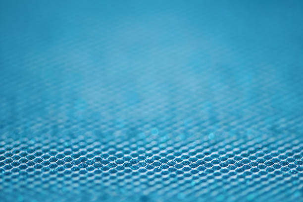 Glitter paper defocus as background. Sparkles defocus light. Blue.