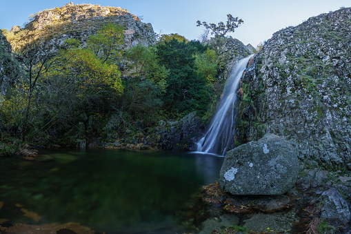 Waterfall called Poco do Inferno with water pool during autumn time, Manteigas, Serra da Estrela, Portugal