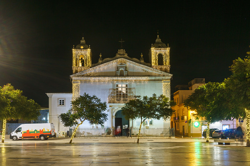 Urban landscape at night with Catholic Church Igreja de Santa Maria in Lagos, Algarve, Portugal