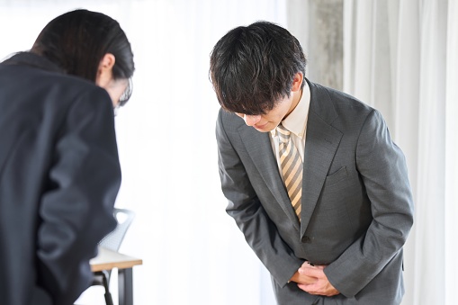 Asian businessman bowing face to face