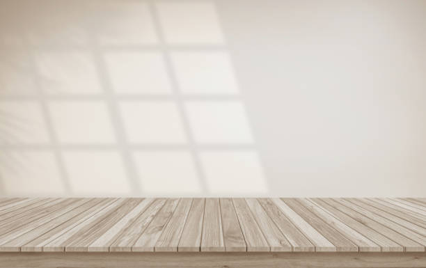 istock Minimalistic abstract gentle light beige background for product presentation with light and shadow of window and leaf curtains on wall. Pastel cream watercolor concrete wall old on floor wood parquet. 1998899066