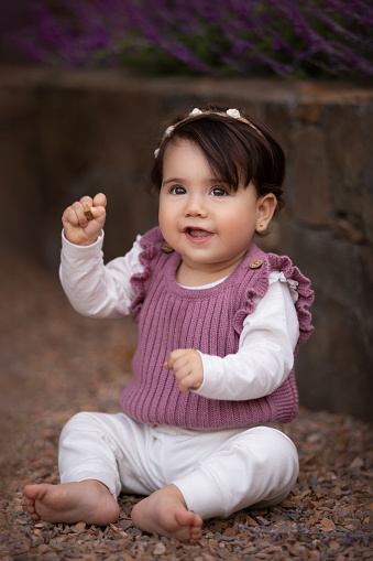 Cute one year old Latin American girl enjoying outdoors - Buenos Aires Province - Argentina