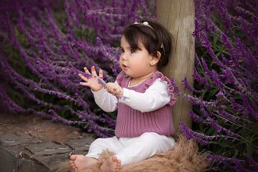 Cute one year old Latin American girl enjoying outdoors - Buenos Aires Province - Argentina
