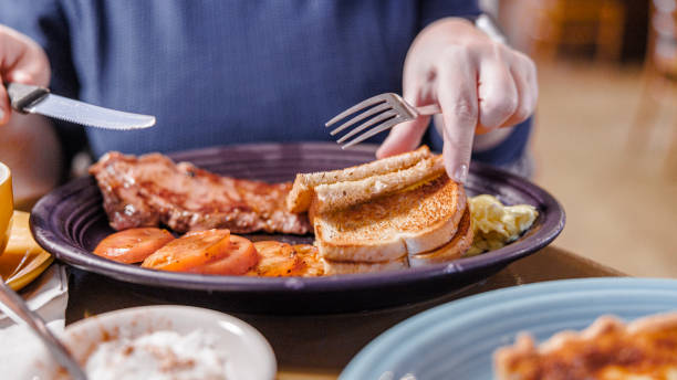 main dish in a restaurant. eating meat and vegetables with a knife and fork - steak plate gourmet beef imagens e fotografias de stock