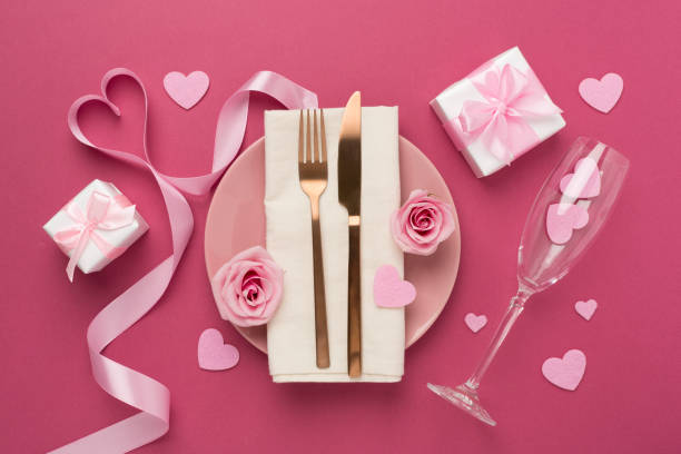 istock Festive table setting for Valentine's Day on color background, top view 1998933131