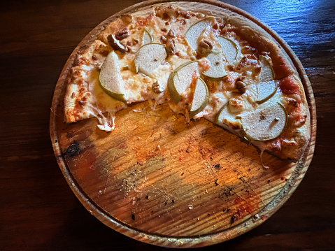 Mexico: Half-Eaten Pizza with Pear Slices