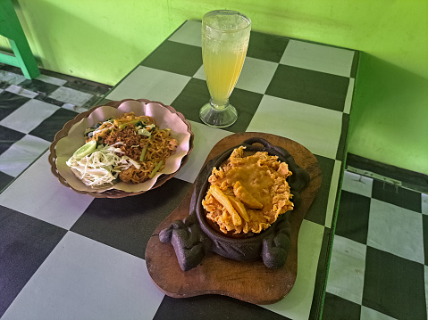 Fried Noodles Or Mie Goreng And Chicken Steak With Lime Iced.  Mi Goreng Dan Steak Ayam Dengan Es Jeruk Nipis. Food And Drink Menu.