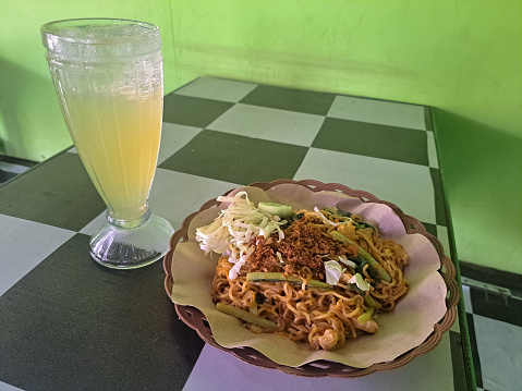 Fried Noodle Or Mie Goreng With Fried Onion Sprinkles, Mix Vegetable And Lime Iced. Mi Goreng Dengan Bawang Goreng Tabur, Campuran Sayuran Dan Es Jeruk Nipis. Food And Drink Menu.