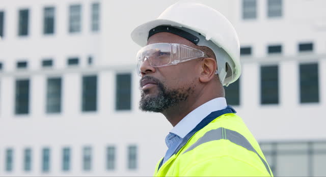 Thinking, construction worker and a black man in the city for building of infrastructure. Creative, designer and an African builder or contractor on site with vision for architecture or maintenance