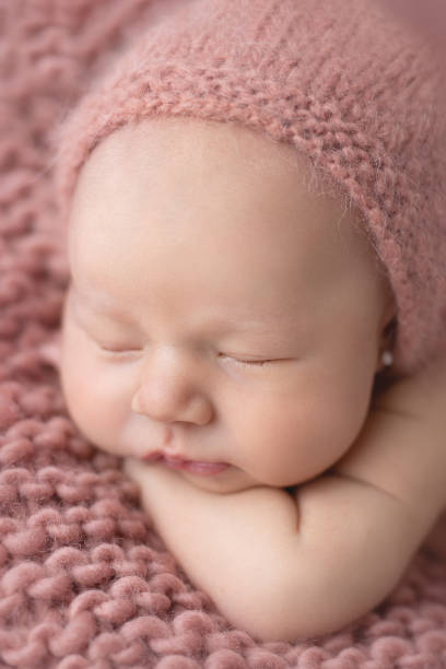 istock Newborn baby girl sleeping 1999031386