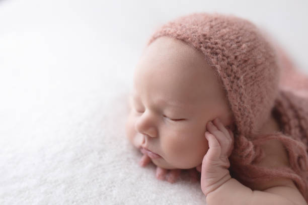 istock Newborn baby girl sleeping 1999031404