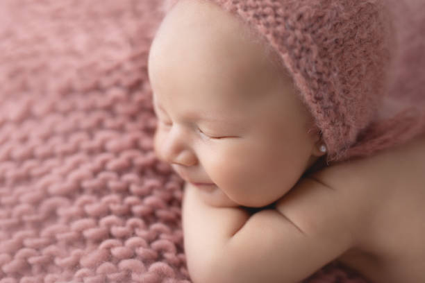istock Newborn baby girl sleeping 1999031431