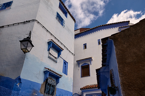 Street blue and white houses exterior in Chefchaouen, Morocco, North Africa.