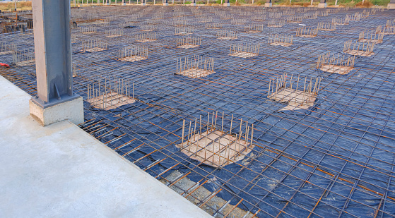 Deep Foundation Footing Reinforcement Steel with wire mesh structure on the Ground for reinforced Concrete Floor work in the Construction Site of Large Industrial Building