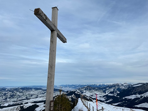 A wooden cross or Christian crucifix on top of the Swiss mountain Kronberg in the Appenzell Alps massif, Urnäsch (Urnaesch or Urnasch) - Canton of Appenzell Innerrhoden, Switzerland (Schweiz)