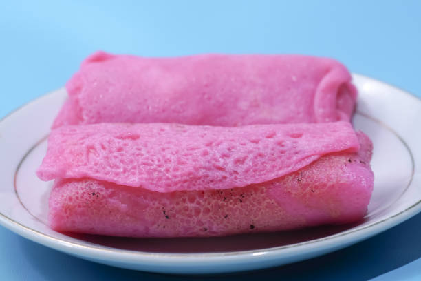 istock Red sweet rolled pancakes 1999117605