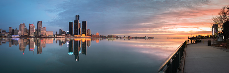 The Detroit skyline at dawn as seen from across the Detroit River, in Windsor, Ontario, Canada.