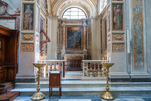 Rome  Italy - May 21 2011; Interior of place of worship side altar surrounded detail and religious art in Basilica di Santa Maria in Trastevere Rome.